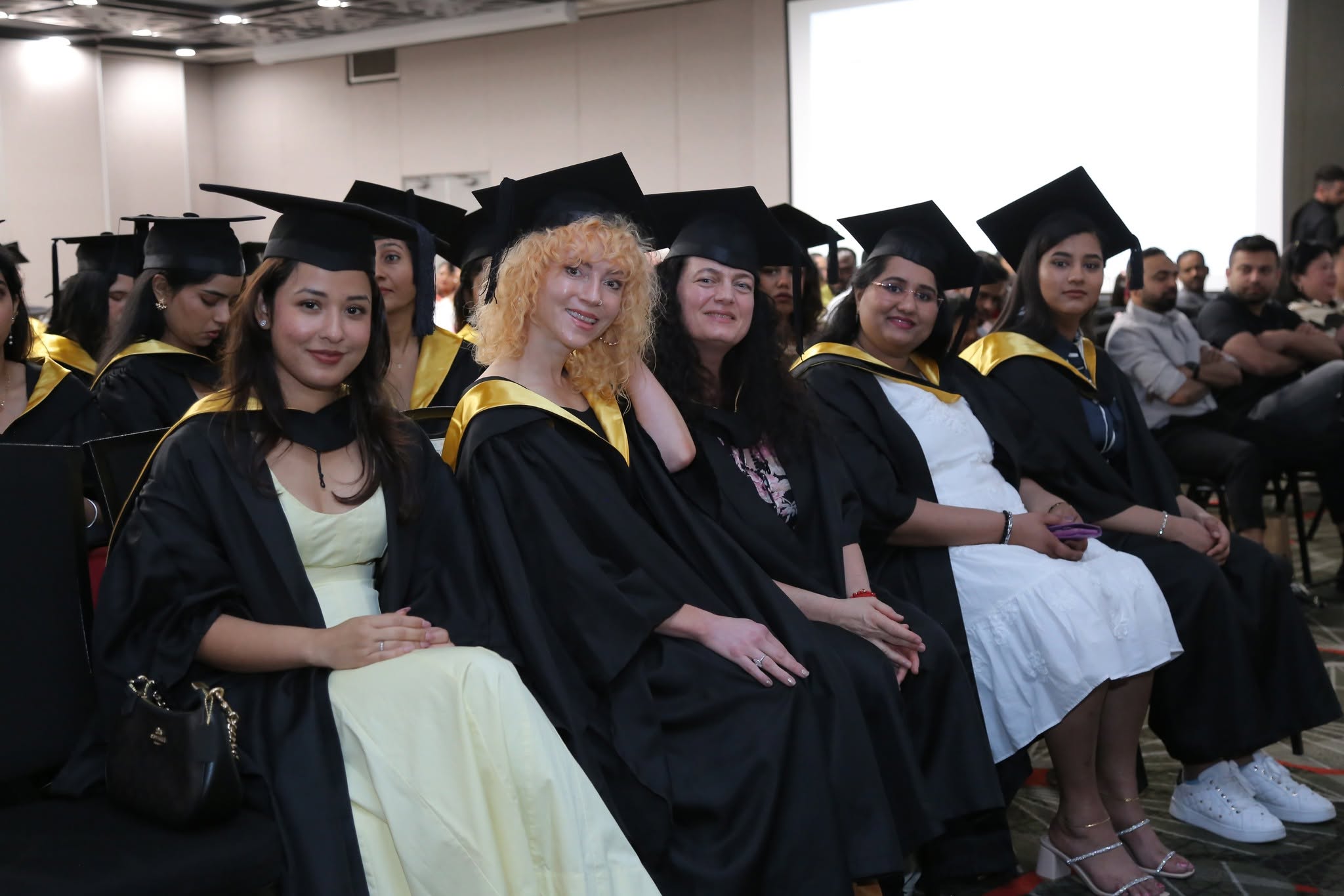 Graduates celebrating at an IHNA event